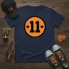 Navy blue t-shirt with a large orange circle containing the number 11 in bold black font and two small black