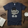 O.O Black Cat in Coffee Cup T-Shirt featuring a cute black cat peeking from a striped mug and text "O.O"