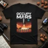 Black t-shirt with "Occupy Mars" text, rocket launching, astronauts planting flag on Mars, and Earth in space