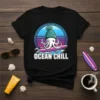 Ocean Chill t-shirt design with a cartoon octopus wearing a beanie surfing on a wave