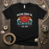 Ocean Crab Co. Est. 1978 vintage t-shirt with a red crab, waves, and sunset graphic