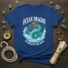 Ocean Dragon Guardian of the Abyss text on a blue t-shirt with a turquoise dragon illustration surrounded by waves