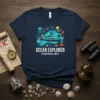 Ocean Explorer Adventures Await t-shirt with a submarine graphic, jellyfish, and fish