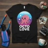 Black t-shirt with "OCTO LOVE" text and a cute pink octopus inside a retro sunset circle graphic