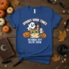 October 31st Selfie Crew Halloween t-shirt design featuring a cat, ghost, witch, and pumpkins, with text "Spooky Good Times"