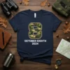 Navy t-shirt with large camouflage number 8 and text "OCTOBER EIGHTH 2024" below