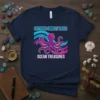 Navy t-shirt with "Octopus Sunset Vibes Ocean Treasures" text and a purple octopus graphic with colorful wavy lines