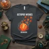 Octopus Wishes Dream Big T-Shirt featuring a school of small octopuses swimming around a glowing sun or planet, with coral
