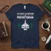 Navy blue t-shirt with white and yellow text "Of Course I'm Awesome I'm Presbyterian" and a graphic of a church