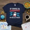 T-shirt with text "OF COURSE I'M EXHAUSTED MY KID IS A PISCES" and a cartoon battery character surrounded by fish