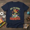 Navy t-shirt with "Off To Cause Kerfuffle" text featuring a cartoon cat superhero flying over a pile of household items