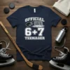 Official 6+7 Teenager hockey design on a navy t-shirt, featuring a puck and net graphic