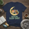 Official Sleep Shirt text with a cute sleeping cat and yarn balls on a moon graphic