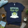 OFFICIAL Sleep shirt design with a cute cartoon frog sleeping in bed under stars and moon