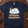 Offizielles Schlafshirt text with a cute white cat sleeping on a cloud, moon, and stars graphic