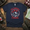 Navy t-shirt with red "OH CANADA Canada" text and a circular emblem of mountains, lake reflection, and maple leaves