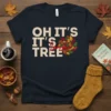 OH IT'S IT'S TREE Love text design with a circular arrangement of colorful autumn leaves on a navy t-shirt