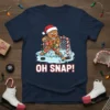 Gingerbread man playing hockey goalie with "OH SNAP!" text, Christmas lights, and festive holiday theme