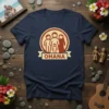 Navy blue t-shirt featuring a circular design with stylized figures representing a family and the word "OHANA" on a banner