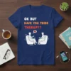 T-shirt with "OK BUT HAVE YOU TRIED THERAPY?" text and illustration of two people in therapy session