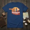 Oklahoma state shape t-shirt design with text "Oklahoma OK Oklahoma OK OK Oklahoma" and graphics of a windmill, wheat, and
