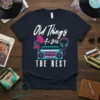 Old Things Are Still THE BEST t-shirt with retro boombox and gramophone design, white and pink text, turquoise and pink