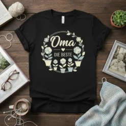 Black t-shirt with "Oma Die Beste" in German, surrounded by a floral wreath and potted flowers