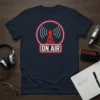 Navy blue t-shirt with a red and white neon-style graphic of a radio tower and "ON AIR" text