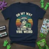 Raccoon wearing sunglasses holding a boombox with text "On My Way To Make The Vibe Weird" on a navy t-shirt