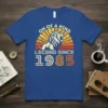 Vintage "On of a Kind Legend Since 1985" t-shirt design with a roaring lion and retro sunset graphic