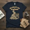 One Does Not Stop Buying Books Because There Is No More Shelf Space quote on a navy t-shirt, featuring a
