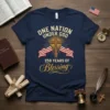 Navy blue t-shirt with "One Nation Under God 250 Years Of Blessing" text, cross, and American flags graphic