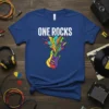 Blue t-shirt with "ONE ROCKS" text and a colorful electric guitar graphic exploding with music notes and shapes