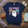 Navy t-shirt with colorful text "ONE SPOOKY BIG SIS" and a cute ghost wearing a flower crown