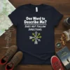 Navy blue t-shirt with white text "One Word to Describe Me? DOES NOT FOLLOW DIRECTIONS." and a compass graphic