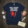 Navy t-shirt with "ONLY LOSERS HAVE THEIR AXPENDIX" text and a cartoon appendix character flexing muscles next to a zipper