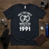 Only the Finest Wrestler are Born in 1991 text with wrestling graphic on a navy t-shirt