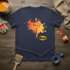 Oops! paint roller t-shirt design with orange and yellow paint splatter and comic-style text