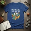 "Open My Eyes That I May See" text on a blue t-shirt with an eye graphic, mountains, and a winding