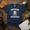 Opossum Whisperer t-shirt design with a cute opossum wearing headphones and sitting at a sound mixer