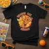 Black t-shirt with "ORANGE CAT ENERGY" text and a muscular orange cat superhero graphic