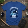 Orca Stargazer Ocean's Cosmos eye-catching graphic design printed on comfortable cotton t-shirt