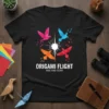 Origami Flight Rise And Soar t-shirt design with four colorful origami birds in flight around a central burst of light
