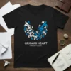 Black t-shirt featuring a blue and white origami heart made of paper airplanes, with "ORIGAMI HEART PAPER FLIGHT" text below