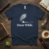 Navy t-shirt featuring "Oscar Wilde." text with a white peacock feather and quill graphic