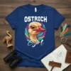 Ostrich Girl T-Shirt featuring a close-up of an ostrich head with colorful abstract feathers and the text "Ostrich Girl" in