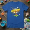 Blue t-shirt with "OUCH!" in a comic book explosion graphic, featuring a heart with a bandage and green goo