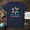 T-shirt with the quote "Our family sticks together" above a circle of diverse stick figures holding hands