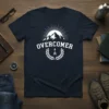 Overcomer t-shirt with mountain graphic, sunburst, laurel wreath, and arrow, navy blue tee