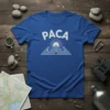 Blue t-shirt with white text "PACA" above a graphic of stylized mountains and a sunburst